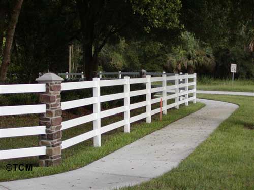 4 rail ranch fence with rock pillars