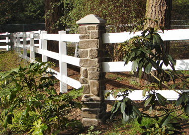 Pillar with 3 rail ranch fence.